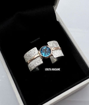 Silver and gold ring with Swiss Blue topaz 6mm