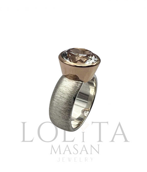 Sudraba un zelta gredzens ar topāzu