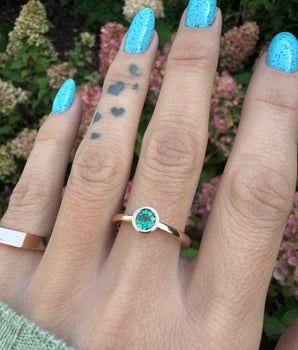 Gold ring with emerald